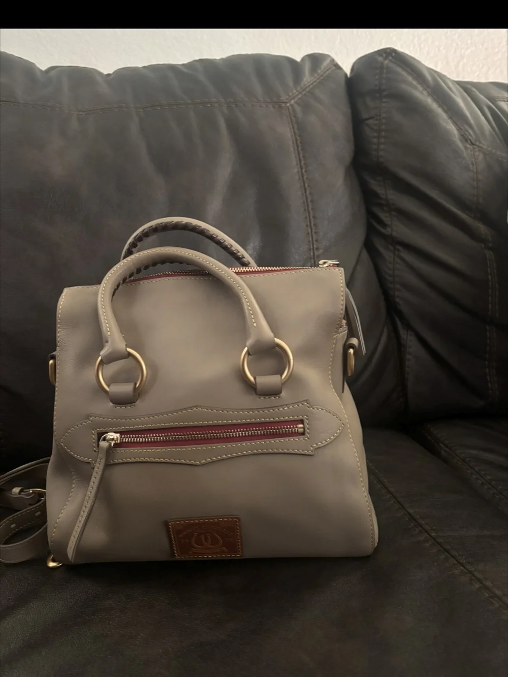 Dooney And Burch Taupe Leather  Crossbody Bag with Tassel